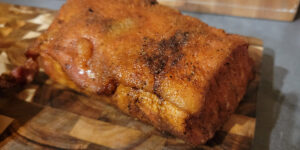 A pork loin roast that is cooling after being baked.