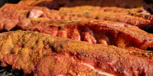 Seasoned ribs ready for the smoker.